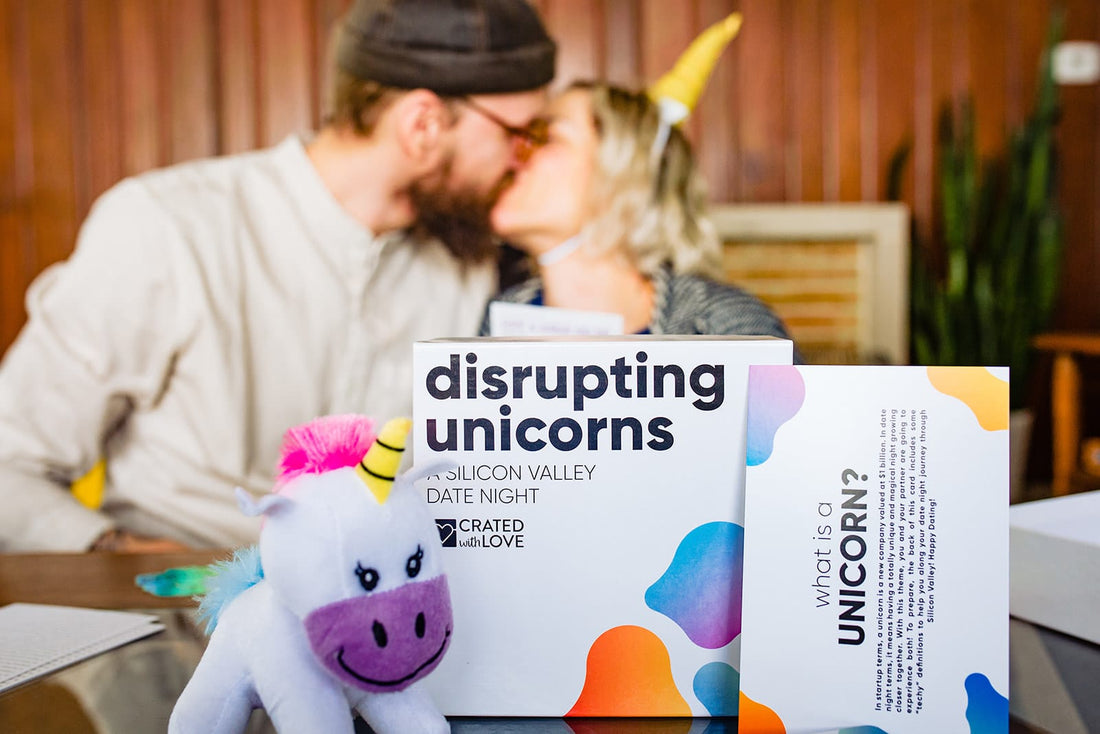 Disrupting Unicorns date night box with couple kissing in the background